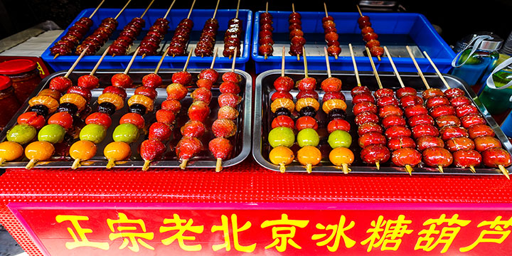 Tanghulu fruit skewers with a hard sugar coating Tanghulu fruit skewers with a hard sugar coating