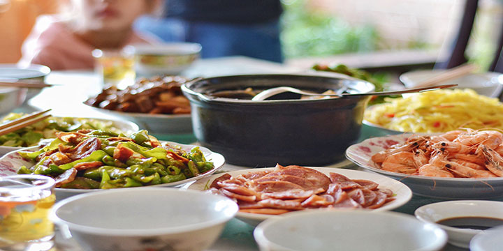 Family-style Chinese meal with regional dishes, vegetables and shared soup Family-style Chinese meal with regional dishes, vegetables and shared soup