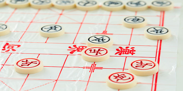 Xiangqi pieces arranged on a Chinese chess board Xiangqi pieces arranged on a Chinese chess board
