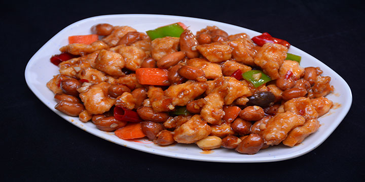 Kung Pao chicken with peanuts, peppers and diced vegetables Kung Pao chicken with peanuts, peppers and diced vegetables