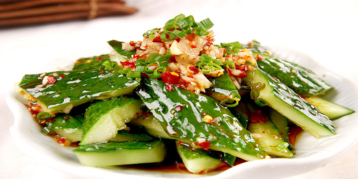 Smashed cucumber cold dish with garlic, sesame and chili dressing Smashed cucumber cold dish with garlic, sesame and chili dressing