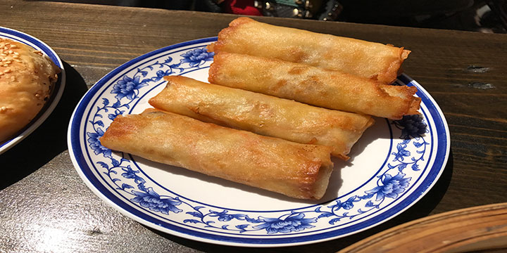 Golden Chinese spring rolls served as a shared starter Golden Chinese spring rolls served as a shared starter