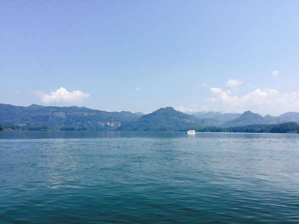 Dajin Lake below red cliffs in Taining, Fujian