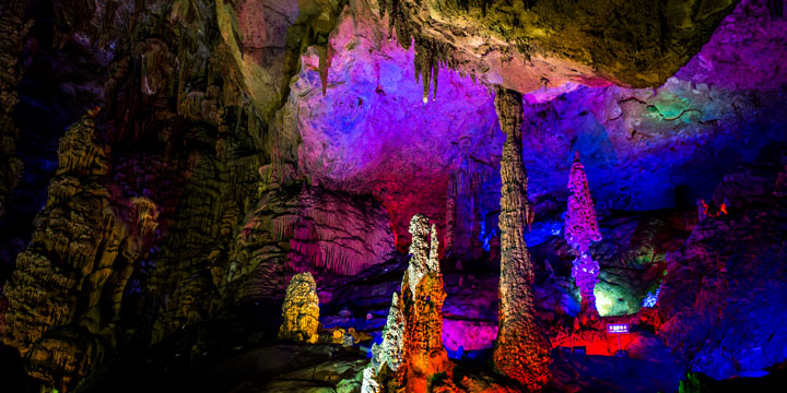 Illuminated limestone formations inside Silver Cave near Guilin