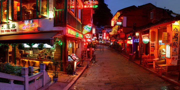 Pedestrian shops and restaurants along West Street in Yangshuo Pedestrian shops and restaurants along West Street in Yangshuo