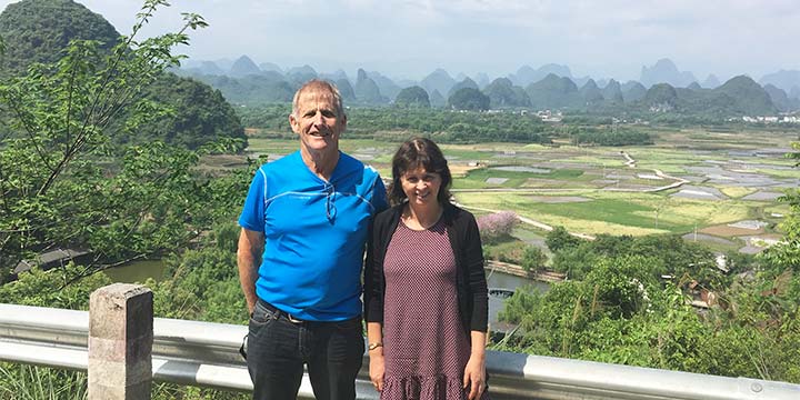 Older travelers at a Guilin countryside viewpoint