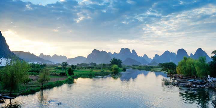 Karst peaks reflected in water near Yangshuo, Guangxi