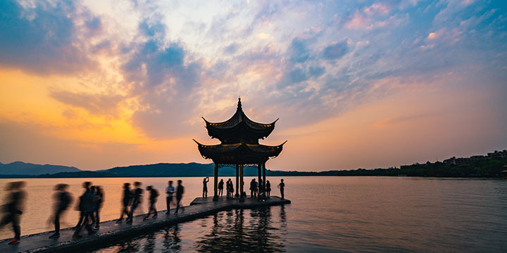 West Lake pavilion and causeway at sunset in Hangzhou West Lake pavilion and causeway at sunset in Hangzhou