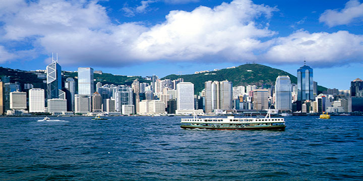 Star Ferry crossing Victoria Harbour between Kowloon and Hong Kong Island