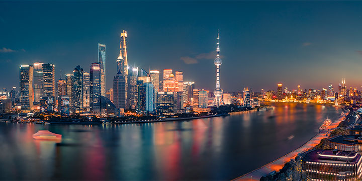 Illuminated Bund and Lujiazui skyline beside the Huangpu River