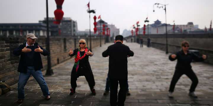 People practicing tai chi on Xi’an City Wall People practicing tai chi on Xi’an City Wall