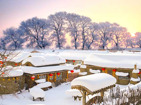 Snow-covered wooden houses at China Snow Town in Heilongjiang Snow-covered wooden houses at China Snow Town in Heilongjiang