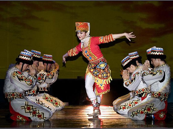 Tajik dancers performing in traditional clothing Tajik dancers performing in traditional clothing