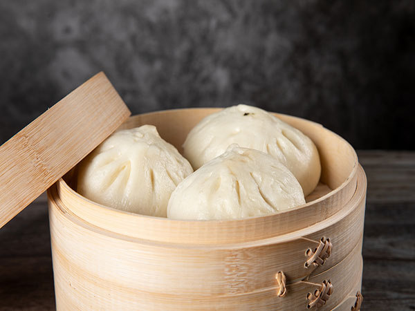 Steamed baozi buns with savory fillings
