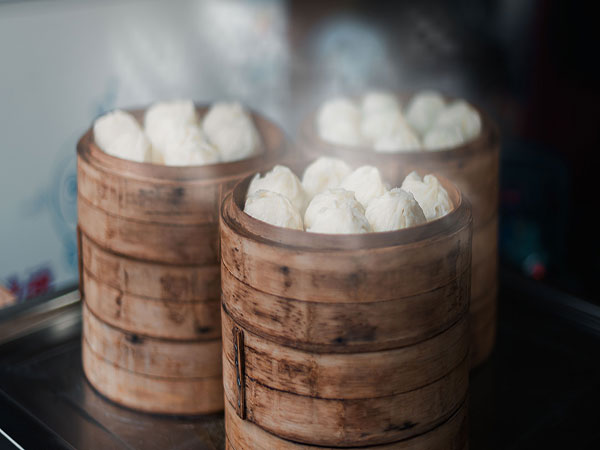 Basket of steamed xiaolongbao dumplings