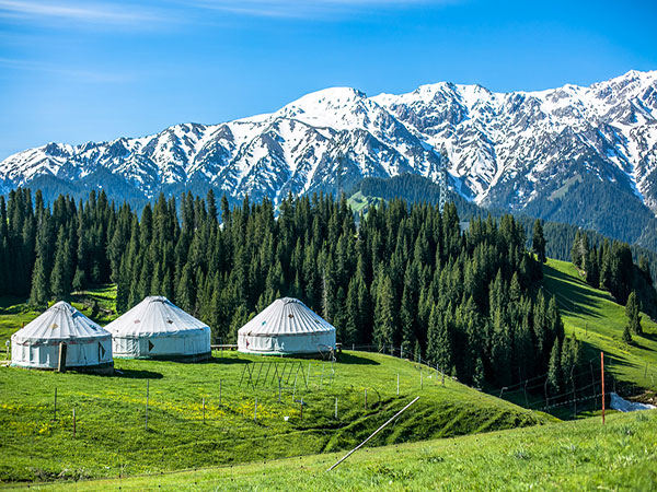 Snow-covered village and mountains in northern Xinjiang Snow-covered village and mountains in northern Xinjiang