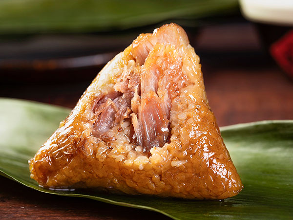 Opened zongzi showing the glutinous-rice filling