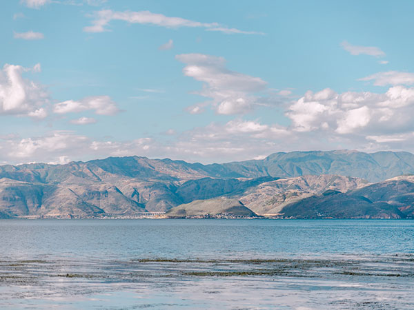 Erhai Lake and mountains in Dali illustrating an inhabited landscape Erhai Lake and mountains in Dali illustrating an inhabited landscape