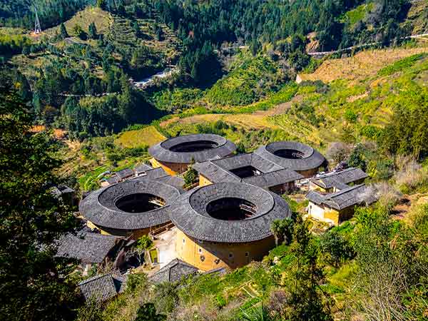 Circular Fujian tulou buildings in a mountain valley