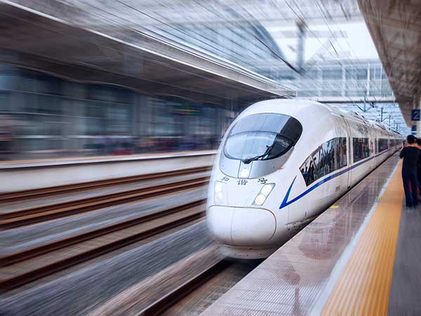 High-speed train arriving at a platform in China High-speed train arriving at a platform in China