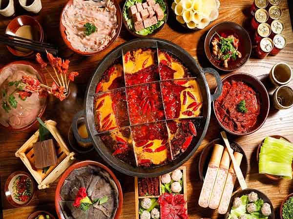 Chongqing-style spicy hot pot served with meat and vegetables Chongqing-style spicy hot pot served with meat and vegetables
