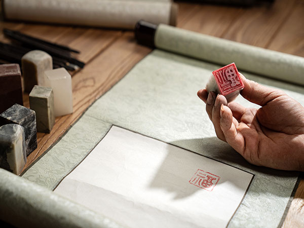 Traditional Chinese calligraphy scroll and carved seal
