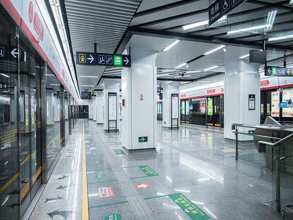 Clean metro platform with bilingual signs in a Chinese city