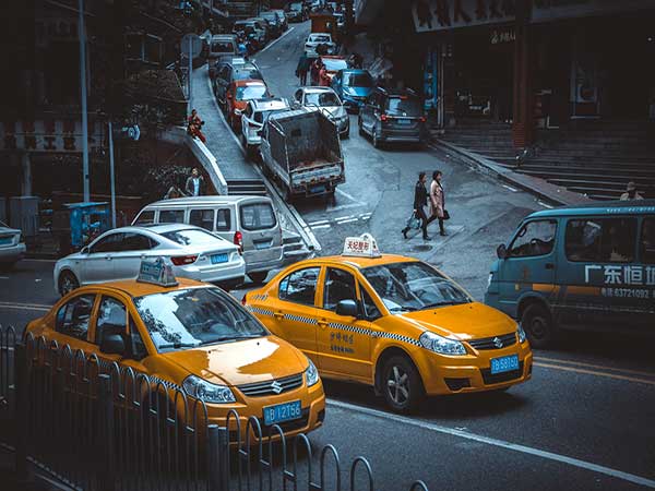 Licensed taxi on a city street in China Licensed taxi on a city street in China