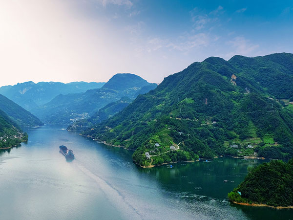 Yangtze River passing through green mountains in the Three Gorges region