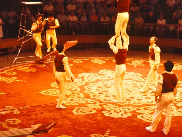 Acrobat performing a carefully rehearsed balancing routine