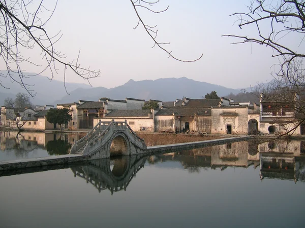 Moon Pond reflecting white-walled traditional houses in Hongcun Village Moon Pond reflecting white-walled traditional houses in Hongcun Village