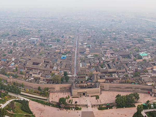 Grey-tiled streets and city wall in the UNESCO-listed Ancient City of Pingyao Grey-tiled streets and city wall in the UNESCO-listed Ancient City of Pingyao