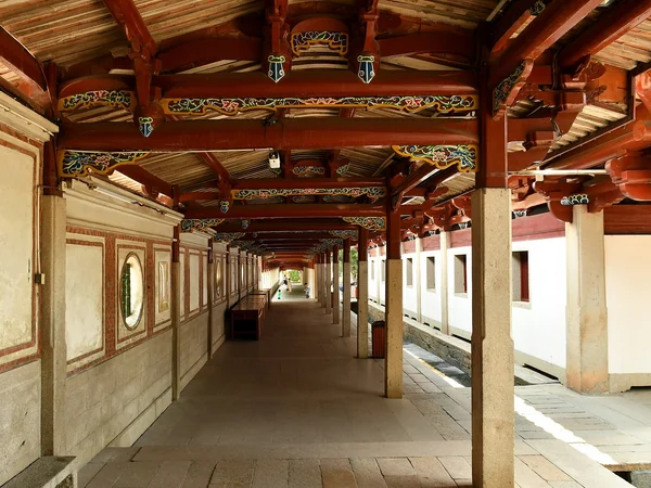 Exposed timber frame inside a traditional Chinese building