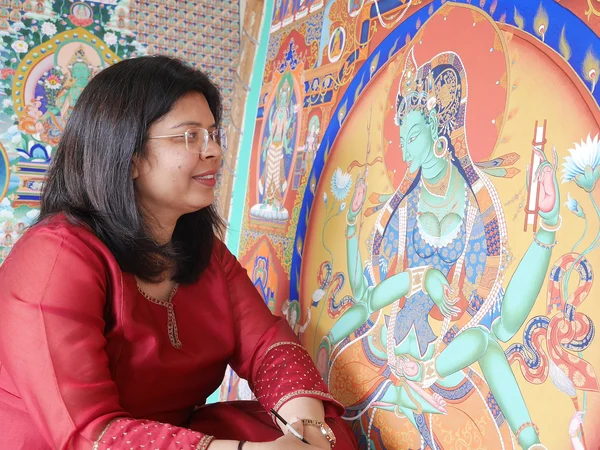 Tibetan artist preparing a thangka painting support Tibetan artist preparing a thangka painting support
