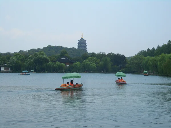 Boats and lakeside scenery at West Lake in Hangzhou