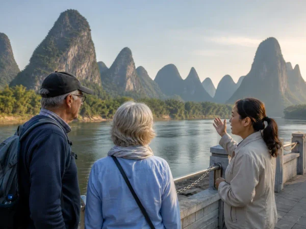 Older travelers and a local guide viewing Guilin karst scenery beside the Li River Older travelers and a local guide viewing Guilin karst scenery beside the Li River