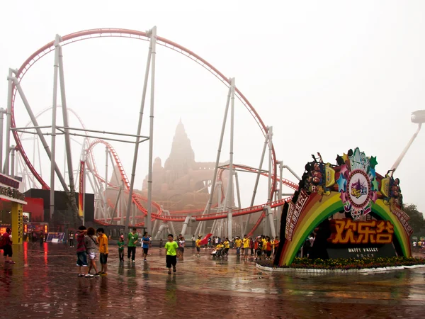 Roller coaster and visitor area at Beijing Happy Valley theme park