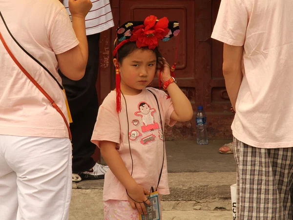 International visitors exploring a historic street in China