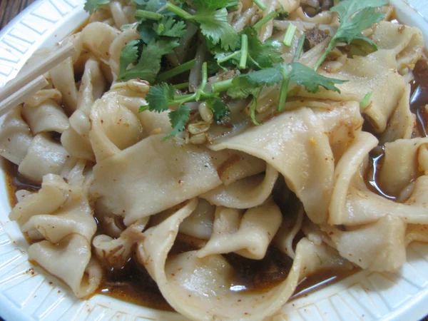 Bowl of wide Biangbiang noodles from Shaanxi cuisine