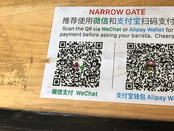 QR codes for Alipay and Weixin Pay displayed by a merchant in China