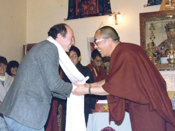 Ceremonial scarf being received during a Tibetan Buddhist meeting Ceremonial scarf being received during a Tibetan Buddhist meeting
