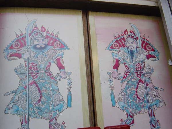 Traditional Chinese door-god images mounted on paired doors Traditional Chinese door-god images mounted on paired doors