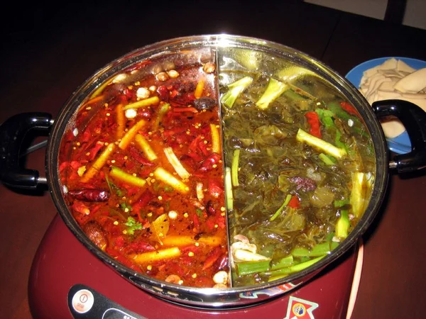 Traditional Chengdu hot pot served at a restaurant table