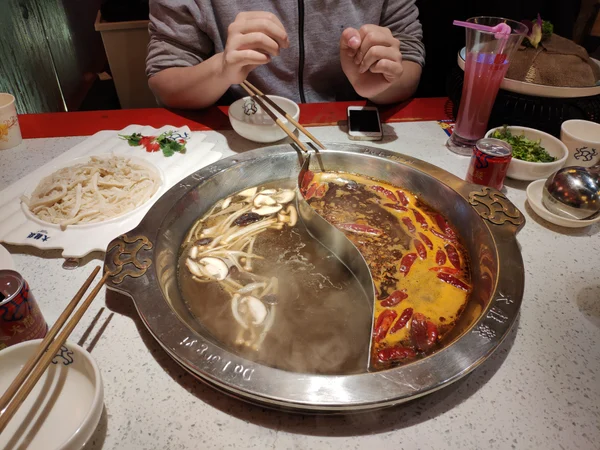 Two-flavour Sichuan hot pot served at a restaurant in Chengdu Two-flavour Sichuan hot pot served at a restaurant in Chengdu