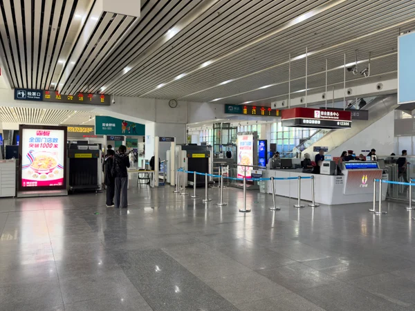 Passengers inside Zhongshanbei Railway Station in China Passengers inside Zhongshanbei Railway Station in China