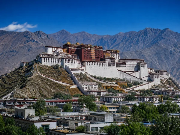 Potala Palace and Tibetan plateau mountains in Lhasa