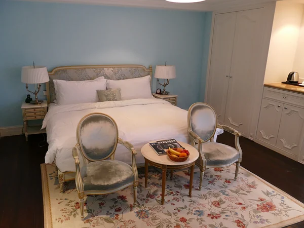 A modern hotel room showing the space and facilities to compare before booking
