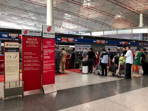 International travelers arriving at a major airport in China International travelers arriving at a major airport in China