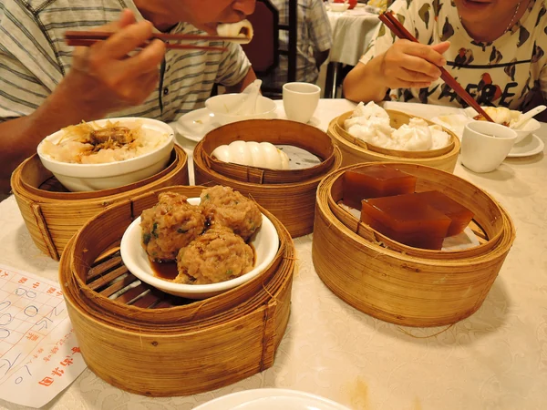Dim sum dishes arranged for a shared Chinese restaurant meal