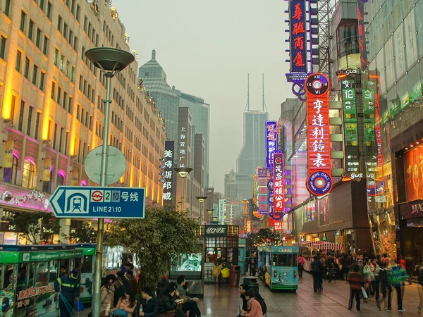 People walking along East Nanjing Road pedestrian street in Shanghai